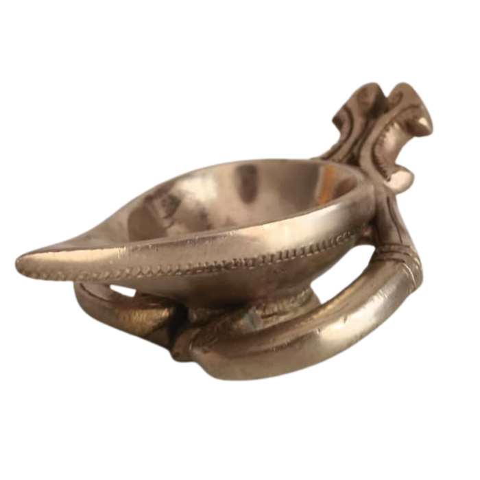 Handcrafted brass diya with intricate patterns, a decorative brass lamp by Thar.