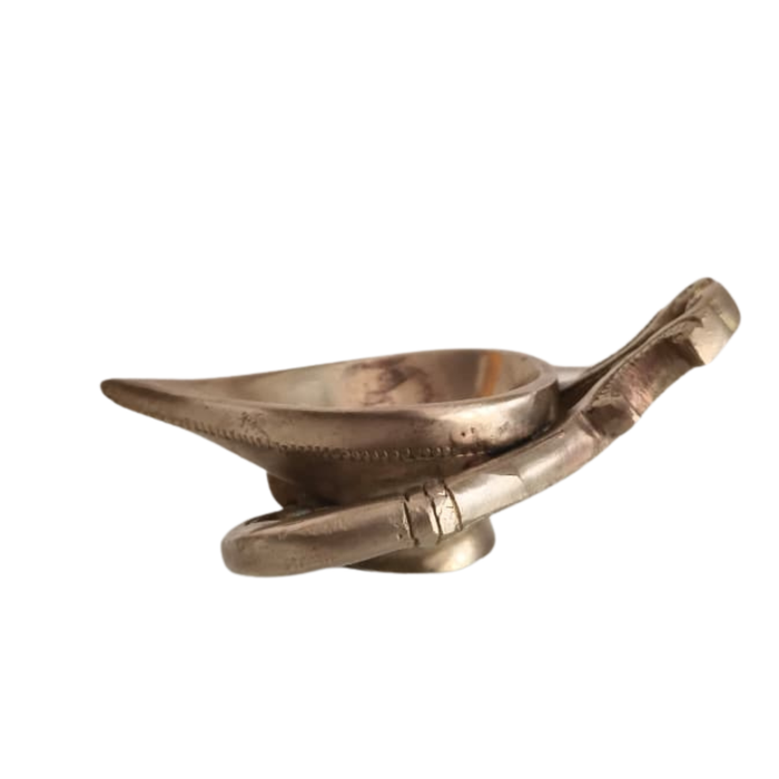 Handcrafted brass diya with intricate details, a decorative brass lamp from Thar.