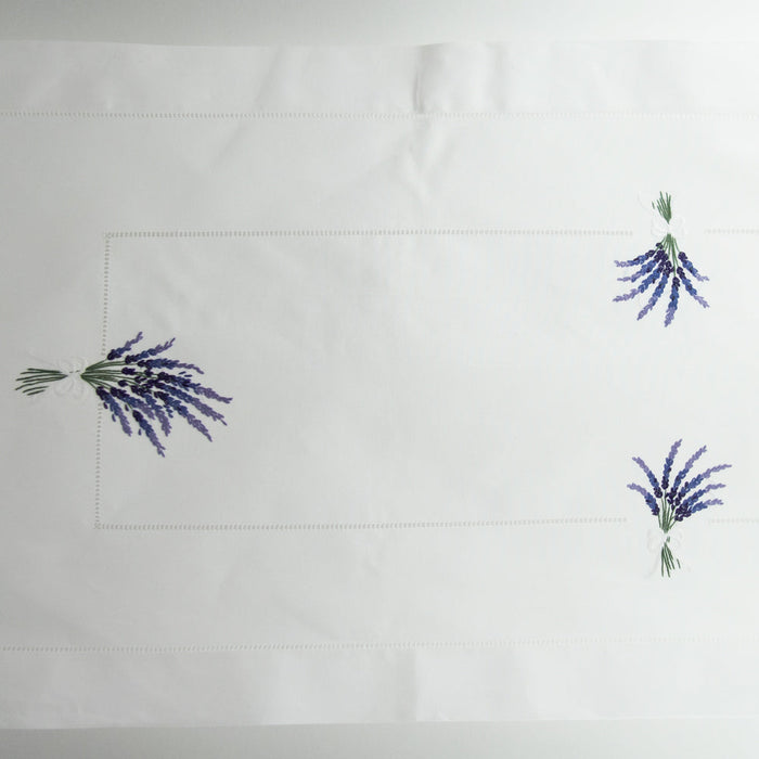 A close up shot of the runner with 3 bundles of lavender on it