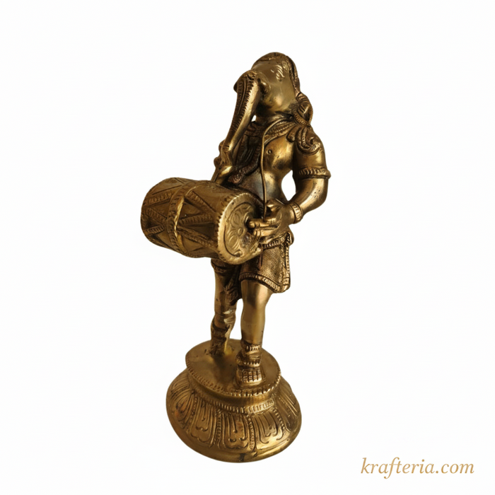 Brass Ganesha dholak statue for home altar decor.