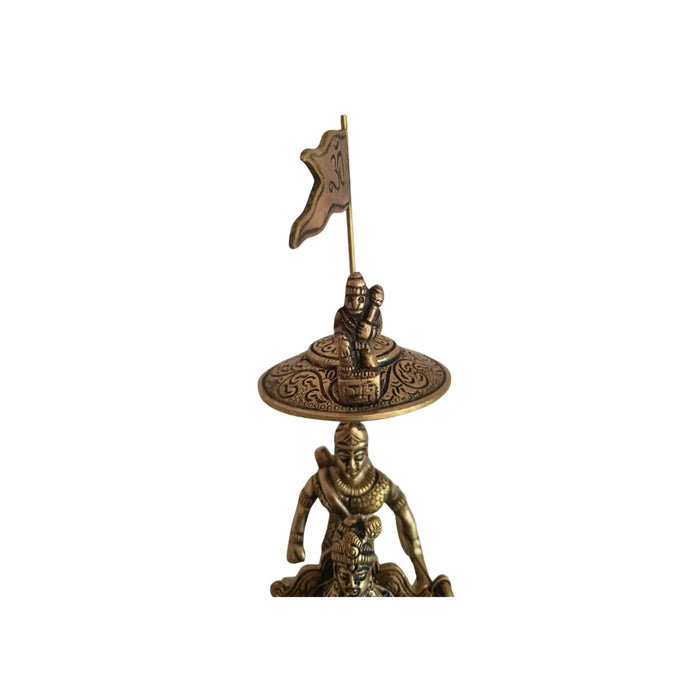 Brass krishna arjuna chariot idol, a religious home decor piece.