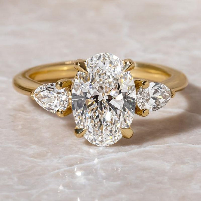 Noble Oval Cut Three Stone Engagement Ring