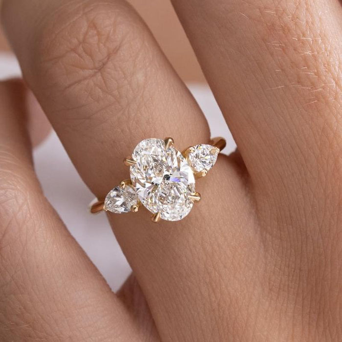 Noble Oval Cut Three Stone Engagement Ring