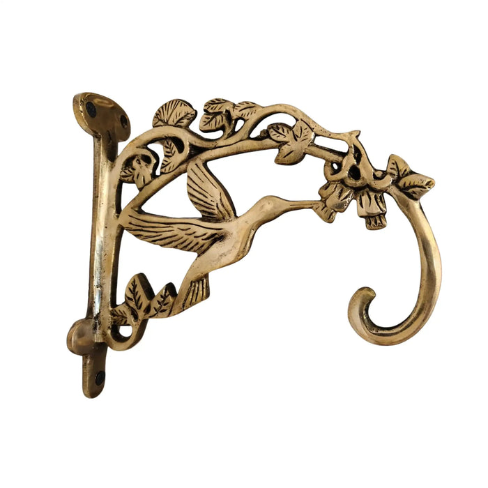 Ornate antique brass wall bracket for hanging items.