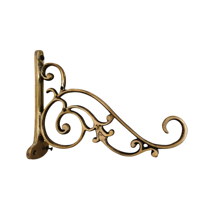 Ornate antique brass wall bracket, a decorative metal hanging fixture.