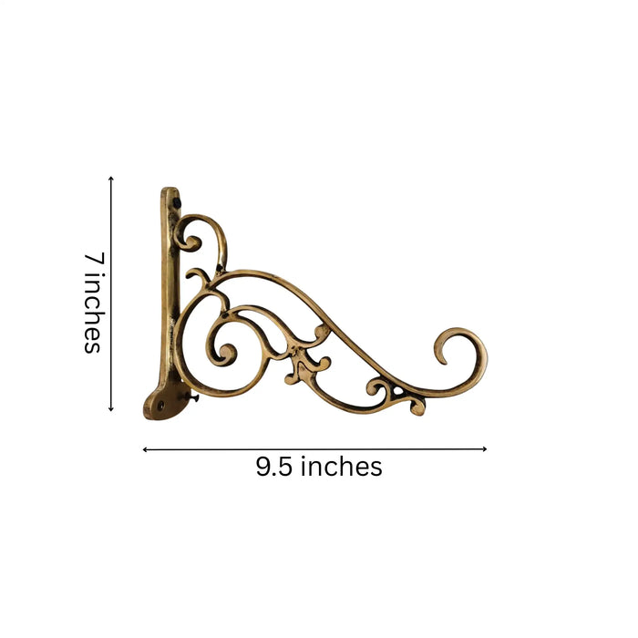Ornate antique brass wall bracket for hanging decor.