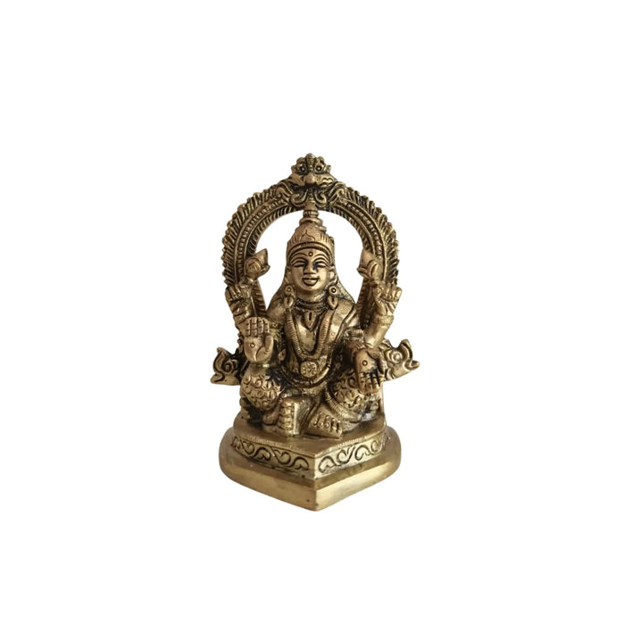 Ornate brass Ganesha and Lakshmi idols.