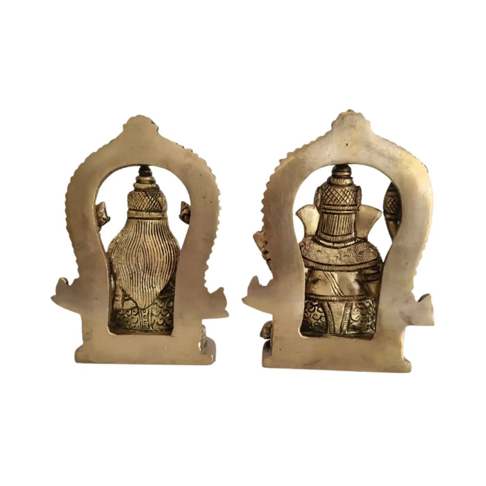 Ornate brass Ganesha and Lakshmi idols, intricate details, Hindu deities for prosperity and wisdom.