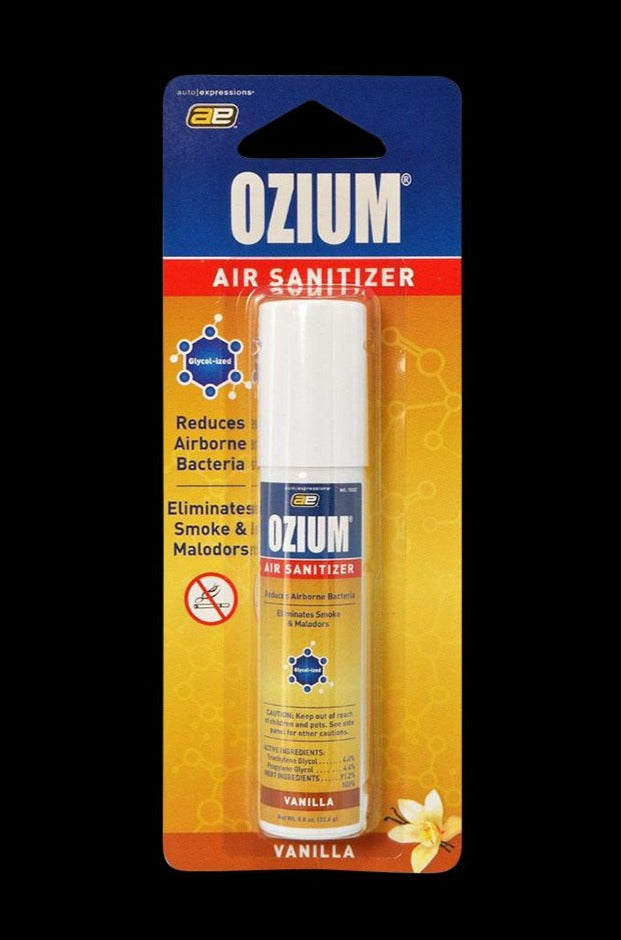 Center-frontal shot of the Ozium Scented 0.8oz Air Sanitizer in its yellow-orange blister pack with a white cap and "Vanilla" label.