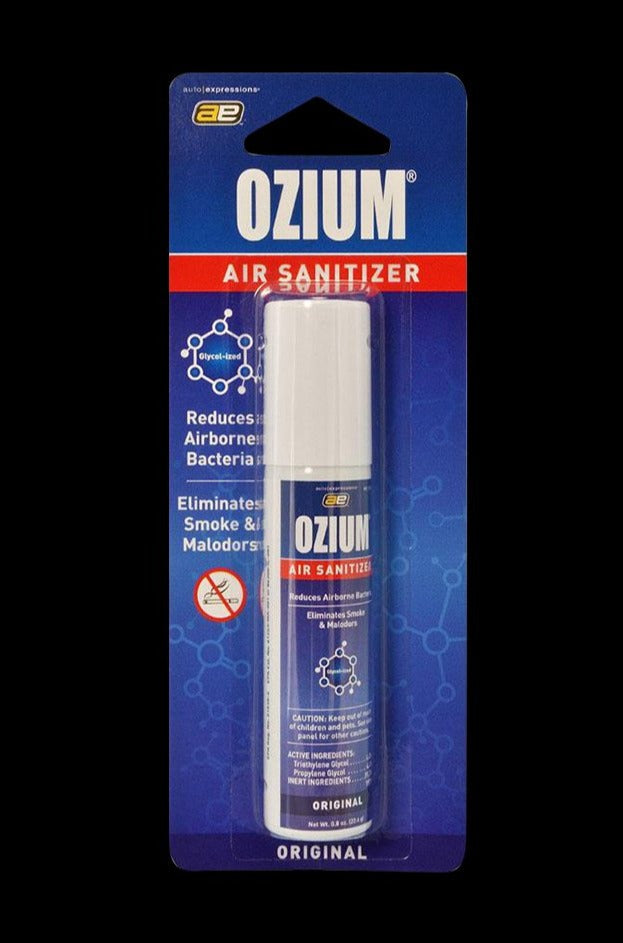 Center-frontal shot of an Ozium Scented 0.8oz Air Sanitizer in its blue blister pack, lit evenly against a black background.