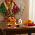 Auspicious pair of swastik diyas in brass, oil lamps.