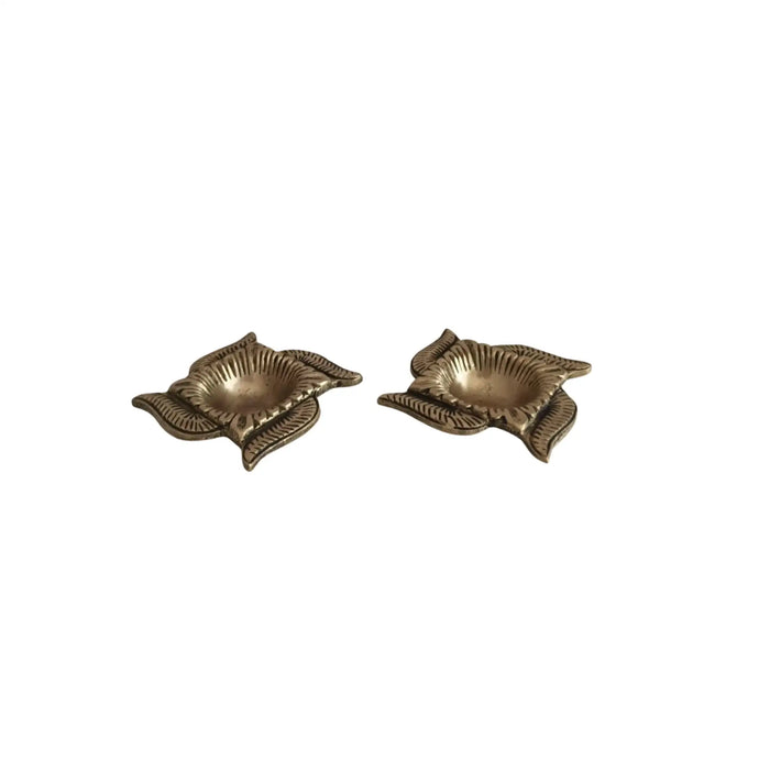 Pair of Swastik Diyas, auspicious brass oil lamps.