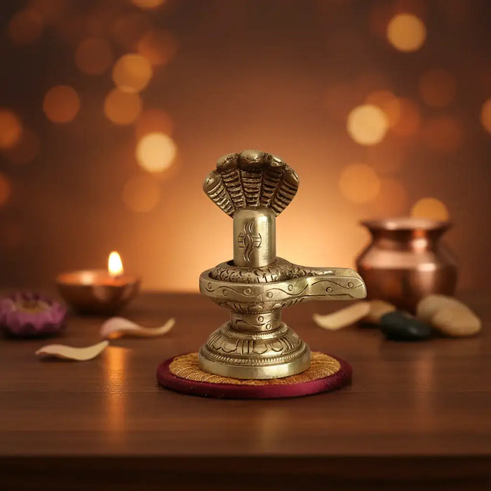 Sacred Brass Shiva Lingam and Yoni Pitha Adorned with Multi-Hooded Naga   Brass Ware