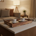 Rustic acacia wood slatted serving tray with natural finish and cutout handles for kitchen and dining use