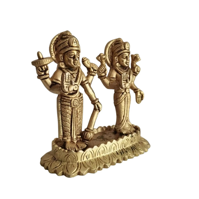 Sacred brass Vishnu Lakshmi idol on lotus, representing divine prosperity.