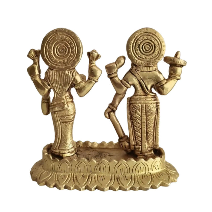 Sacred brass Vishnu Lakshmi idol on lotus, symbolizing divine prosperity.