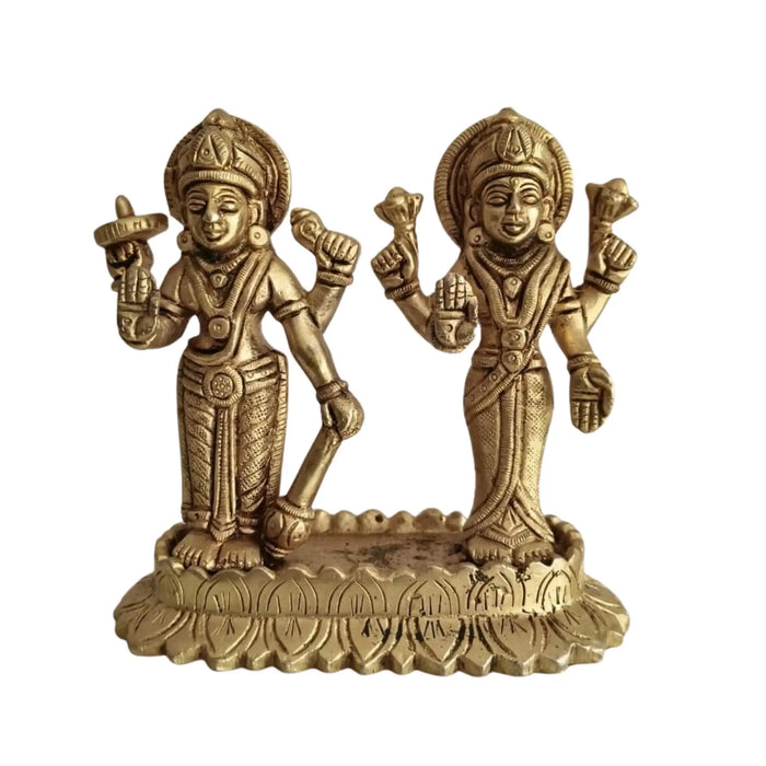 Sacred brass Vishnu Lakshmi idol on lotus, symbolizing divine prosperity.