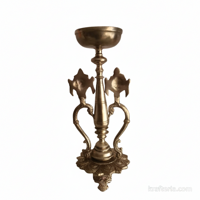 Sacred brass Vishnu lamp with shankh and chakra on pedestal, perfect for altars.