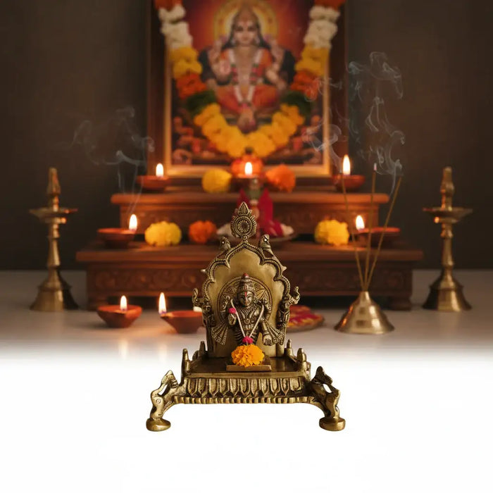 Ornate Brass Puja Singhasan throne for deities, intricately carved brass ware.