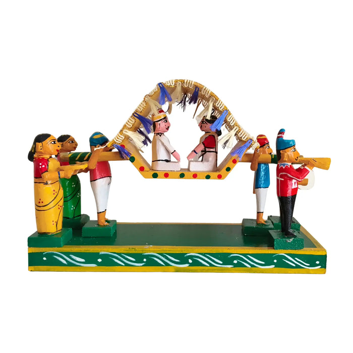 Kondapalli Pelli Pallaki doll showpiece, intricately crafted bridal palanquin with figures.