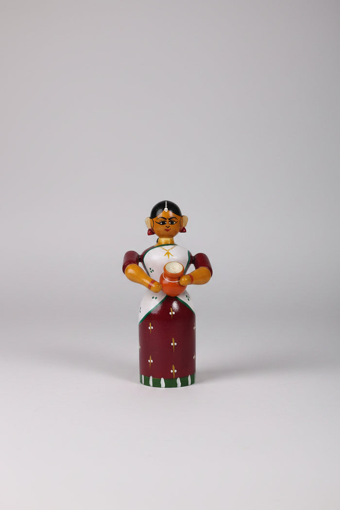 Handmade Etikoppaka wooden doll for home decor.