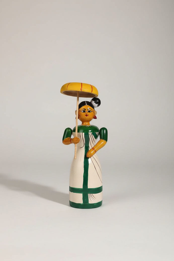 Traditional Etikoppaka wooden doll holding an umbrella, perfect for home decor.