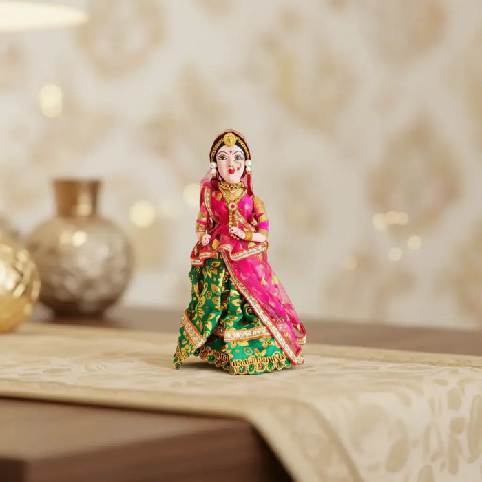 Handcrafted traditional Indian bride doll figurine dressed in vibrant bridal attire with intricate detailing