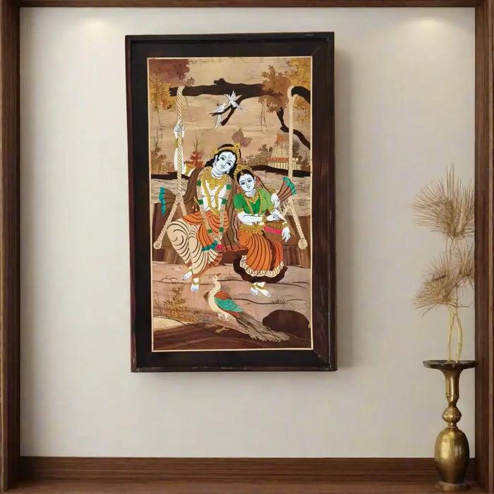 Mysore Inlay Framed artwork of two women on a swing with a wooden frame.