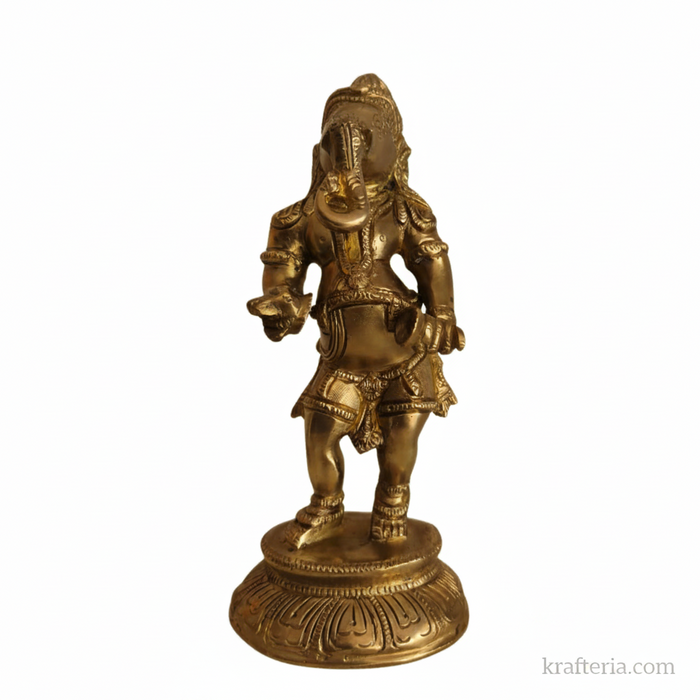 Traditional Ganesha cymbals idol of brass, playing cymbals on altar.