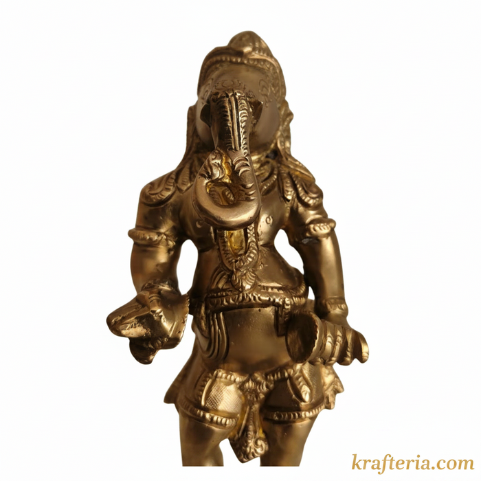 Traditional Ganesha cymbals idol made of brass on an altar.