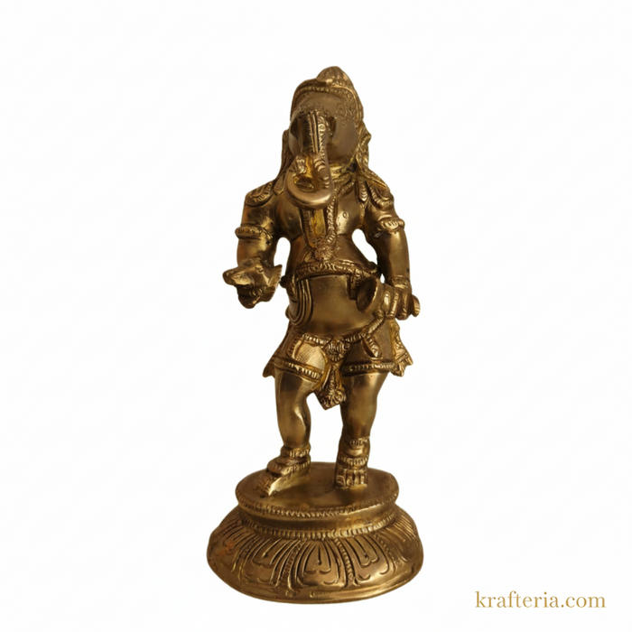 Traditional Ganesha cymbals idol in brass, a religious altar statue.