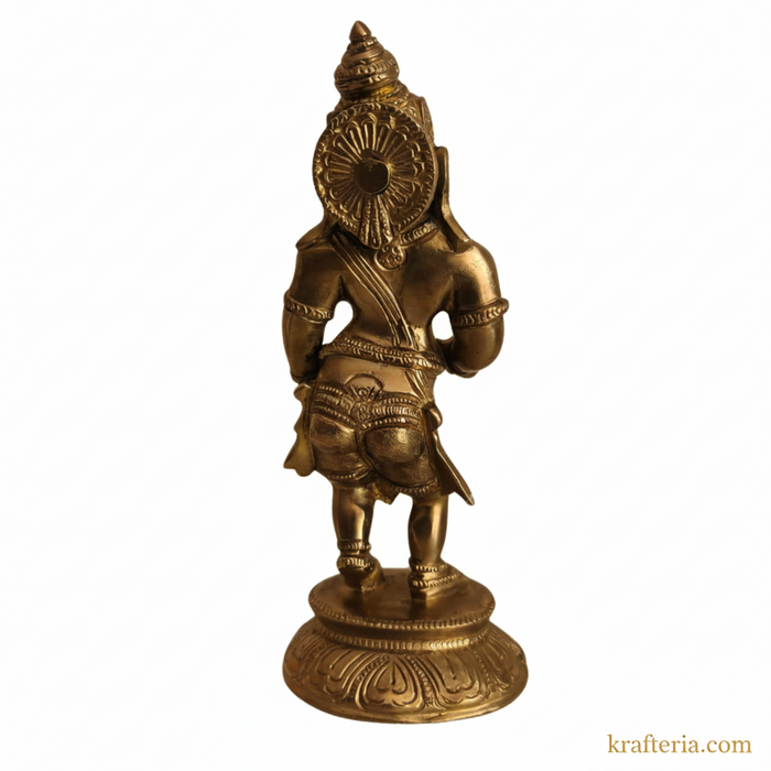 Brass ganesha cymbals idol on altar.
