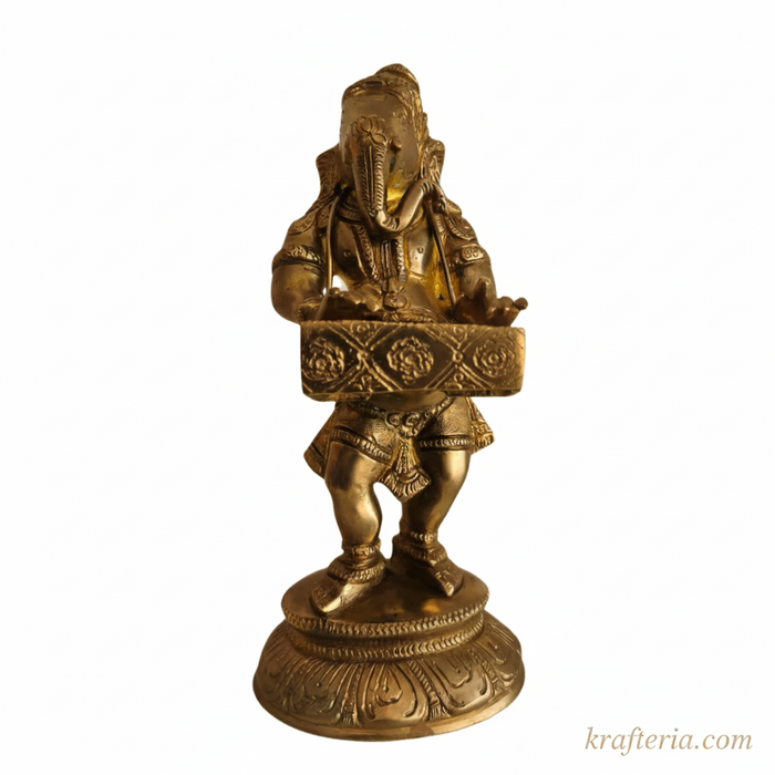 Lord Ganesha harmonium idol, a brass religious statue of the deity playing the instrument.