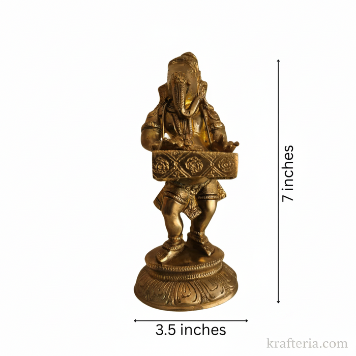 Lord Ganesha harmonium idol in brass, a traditional altar piece.