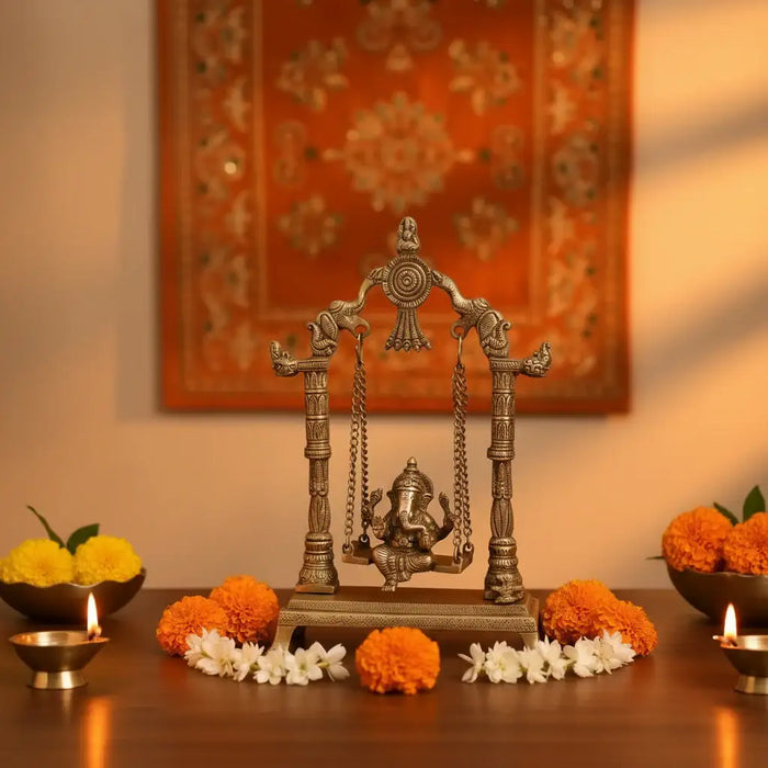Unique Brass Lord Ganesha on Swing (Jhula): Idol of Joy, Playfulness, and Auspiciousness   Brass Ware